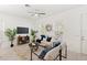 Open-concept living room with large windows providing ample natural light and contemporary furnishings at 9425 Holliston Creek Pl, Winter Garden, FL 34787