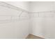 Walk-in closet features bright white walls and wire shelving at 9425 Holliston Creek Pl, Winter Garden, FL 34787