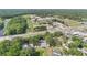 A nice aerial view of the property including nearby community features and a beautiful tree-lined perimeter at 9616 River Walk Ct, Orlando, FL 32825