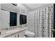 Bathroom featuring modern fixtures, updated vanity, and a shower-tub combo with decorative curtain at 9616 River Walk Ct, Orlando, FL 32825