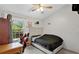 Cozy bedroom featuring a comfortable bed and a large window at 9616 River Walk Ct, Orlando, FL 32825