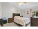 Cozy bedroom features natural light from the windows, neutral walls and comfortable bed at 9616 River Walk Ct, Orlando, FL 32825