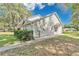 The home boasts beautiful siding and lush greenery around the perimeter at 9616 River Walk Ct, Orlando, FL 32825