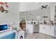 Bright kitchen area with a view into the living room, and a functional office space at 9616 River Walk Ct, Orlando, FL 32825