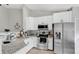 Kitchen with white cabinets, granite countertops and stainless steel appliances at 9616 River Walk Ct, Orlando, FL 32825