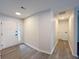 Neutral entryway showcasing light wood-look floors and a front door with sidelight window at 965 Brentwood Dr, Apopka, FL 32712