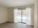Light-filled room with wood-look floors and sliding glass doors offering views of the pool area at 965 Brentwood Dr, Apopka, FL 32712