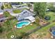 Aerial view of private backyard oasis, showcasing pool, patio, garden, and ample green space at 969 Gran Paseo Dr, Orlando, FL 32825