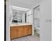 Bathroom with vanity and a view to the bedroom through the mirror at 969 Gran Paseo Dr, Orlando, FL 32825