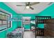Bedroom featuring bunk beds, a ceiling fan, and multiple windows for natural light at 969 Gran Paseo Dr, Orlando, FL 32825