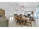 Open-concept dining room featuring fireplace and furniture, connects to the living spaces at 969 Gran Paseo Dr, Orlando, FL 32825