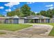 Charming home boasts a wide driveway, solar panels and beautiful landscaping at 969 Gran Paseo Dr, Orlando, FL 32825