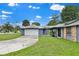 Charming home features an attached garage and beautiful landscaping at 969 Gran Paseo Dr, Orlando, FL 32825