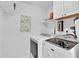 Functional laundry room with modern appliances and ample storage space at 969 Gran Paseo Dr, Orlando, FL 32825