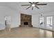 Cozy living room featuring a unique stone fireplace, tiled floors, and modern fan at 969 Gran Paseo Dr, Orlando, FL 32825