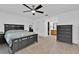 Comfortable main bedroom with ceiling fan leads into the bathroom and walk-in closet at 969 Gran Paseo Dr, Orlando, FL 32825