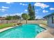 Sparkling pool with a small waterfall feature, surrounded by a well-maintained fenced yard at 969 Gran Paseo Dr, Orlando, FL 32825