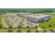 Aerial view of school with ample parking, sports courts, and green spaces at 10520 Burrows St, Orlando, FL 32832