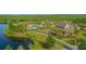 Stunning aerial view of community pool, clubhouse, and lush landscaping at 10520 Burrows St, Orlando, FL 32832