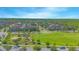 Beautiful aerial view of a planned community with green spaces and well-maintained homes on a sunny day at 10520 Burrows St, Orlando, FL 32832