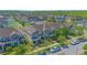 A planned community shown from above features green spaces, sidewalks, and plentiful parking at 10520 Burrows St, Orlando, FL 32832