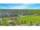 Beautiful aerial view of a planned community with green spaces and well-maintained homes on a sunny day at 10520 Burrows St, Orlando, FL 32832