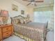 Cozy bedroom with decorative bed frame, natural light, and calming color palette at 10520 Burrows St, Orlando, FL 32832