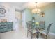 Cozy breakfast nook with glass table, decorative wall art, and plenty of natural light at 10520 Burrows St, Orlando, FL 32832