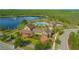 Aerial view of resort-style pool and clubhouse with lakeside views at 10520 Burrows St, Orlando, FL 32832