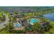 Aerial view of resort-style pool, splash pad, and clubhouse in a beautiful community at 10520 Burrows St, Orlando, FL 32832
