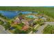 Aerial view of resort-style pool and clubhouse with lakeside views at 10520 Burrows St, Orlando, FL 32832