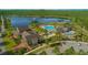 Aerial view of resort-style pool, splash pad and lakeside clubhouse at 10520 Burrows St, Orlando, FL 32832