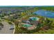 Aerial view of the Gathering-friendly resort-style pool with splash pad and lakeside clubhouse at 10520 Burrows St, Orlando, FL 32832