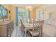 Formal dining room featuring stylish chandelier and table set for a meal at 10520 Burrows St, Orlando, FL 32832