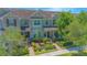 Charming exterior elevation with manicured landscaping and brick pathway leading to covered porches at 10520 Burrows St, Orlando, FL 32832