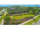 Beautifully maintained green space with walkway and mature landscaping at 10520 Burrows St, Orlando, FL 32832