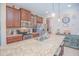 Modern kitchen featuring a large granite island, stainless steel appliances, and dark wood cabinets at 10520 Burrows St, Orlando, FL 32832