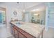 Granite island connects the kitchen to the dining area, creating an open space at 10520 Burrows St, Orlando, FL 32832
