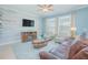 Inviting living room with a decorative wood wall, modern furniture, and plenty of natural light at 10520 Burrows St, Orlando, FL 32832