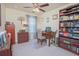 Functional home office featuring a desk, built-in bookcase, and comfortable seating at 10520 Burrows St, Orlando, FL 32832