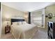 Cozy bedroom featuring a comfortable bed, window nook, and stylish decor at 1074 Kensington Park Ct # 101, Altamonte Springs, FL 32714