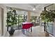 Bright dining room with large windows offering backyard view and a fireplace at 1074 Kensington Park Ct # 101, Altamonte Springs, FL 32714