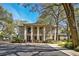 Two-story condo building with lush landscaping and mature trees at 1074 Kensington Park Ct # 101, Altamonte Springs, FL 32714