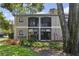 Two-story condo with screened balconies and lush landscaping at 1074 Kensington Park Ct # 101, Altamonte Springs, FL 32714