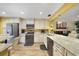 Bright kitchen with stainless steel appliances, granite countertops, and ample cabinet space at 1074 Kensington Park Ct # 101, Altamonte Springs, FL 32714