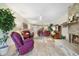 Spacious living room with a brick fireplace, wood-look floors, and neutral decor at 1074 Kensington Park Ct # 101, Altamonte Springs, FL 32714