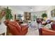 Inviting living room with a brick fireplace, comfortable seating, and plenty of natural light at 1074 Kensington Park Ct # 101, Altamonte Springs, FL 32714