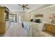 Serene main bedroom with a ceiling fan, plush carpeting, and access to a private patio at 1074 Kensington Park Ct # 101, Altamonte Springs, FL 32714