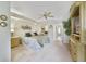 Large main bedroom with a ceiling fan, comfortable bed, and access to the en-suite bathroom at 1074 Kensington Park Ct # 101, Altamonte Springs, FL 32714