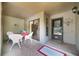 Charming covered patio with tile flooring, a dining table, and access to the unit's entrance at 1074 Kensington Park Ct # 101, Altamonte Springs, FL 32714